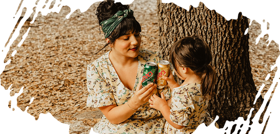 Woman and girl outside drinking Zevia